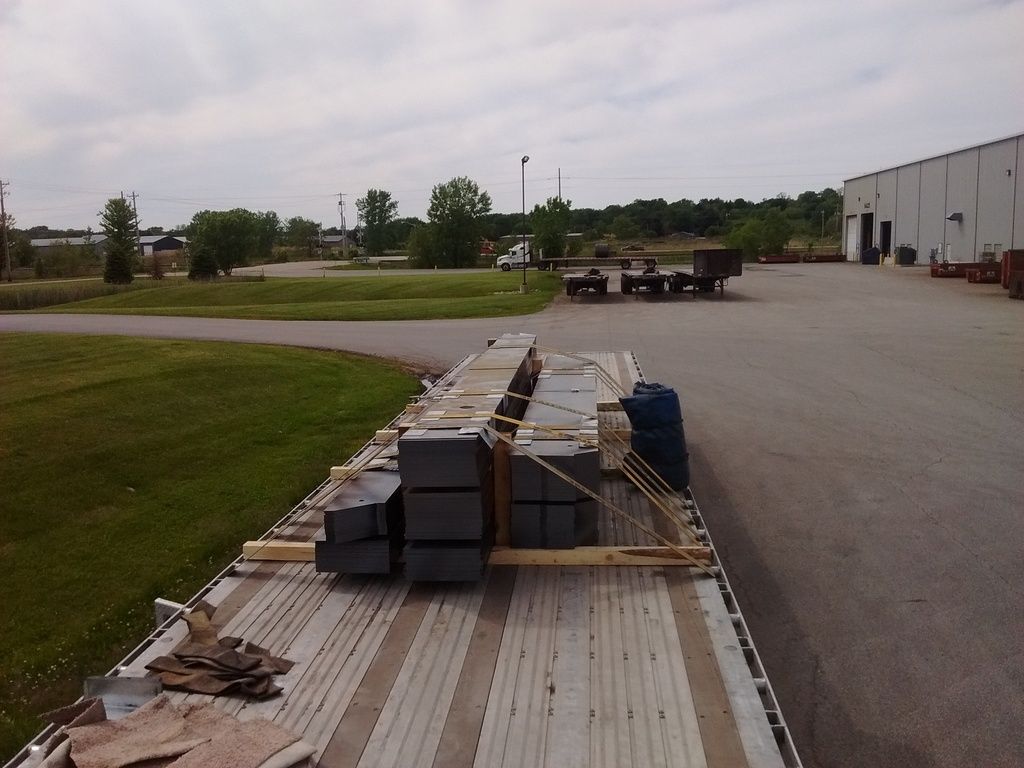 flat steel loaded and strapped on flatbed trailer at Olympic Steel flat steel loaded and strapped on flatbed trailer at Olympic Steel